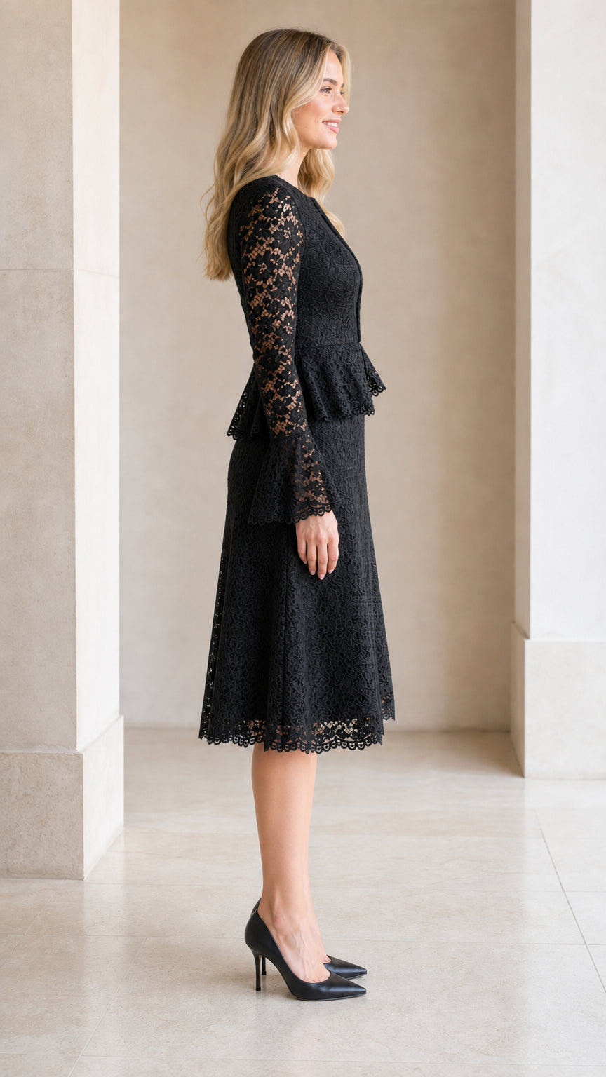 Side profile of model wearing black floral lace peplum midi dress