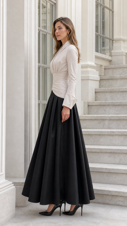 Side profile of beige and black two-tone ruched maxi dress