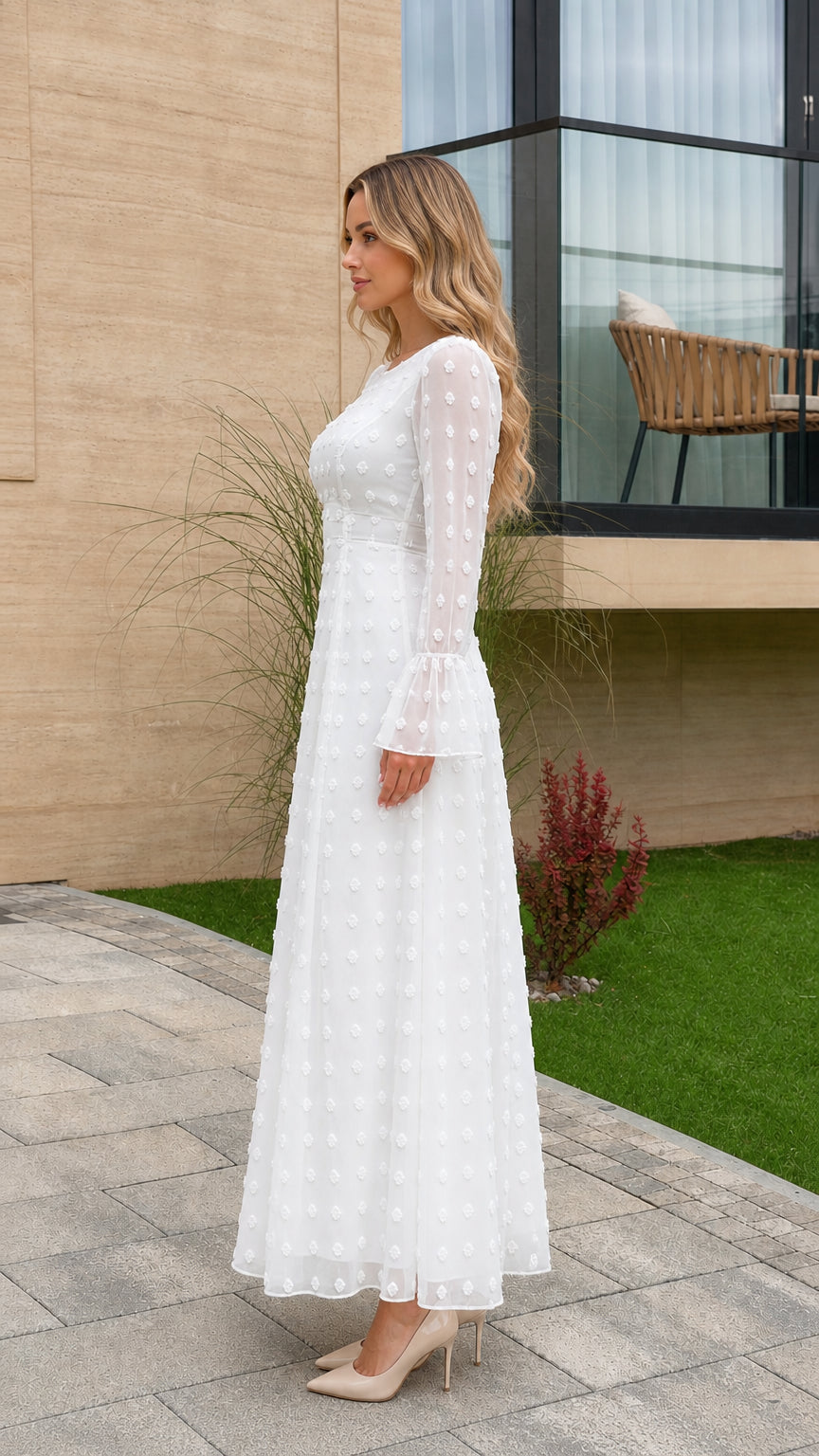 Side profile view of white Swiss dot long sleeve maxi dress