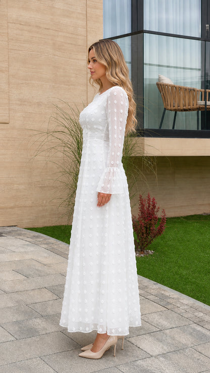 Side profile view of white Swiss dot long sleeve maxi dress