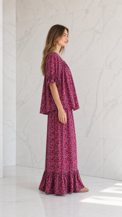 Side view of model wearing magenta floral two-piece pant set