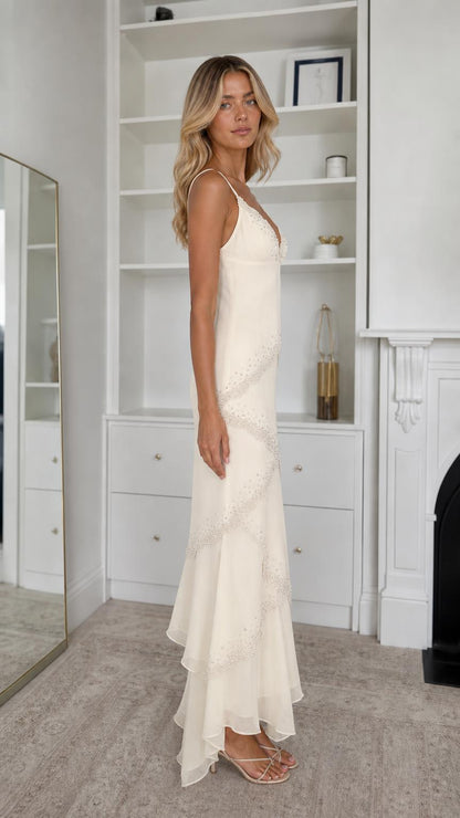 Side profile view of champagne maxi dress