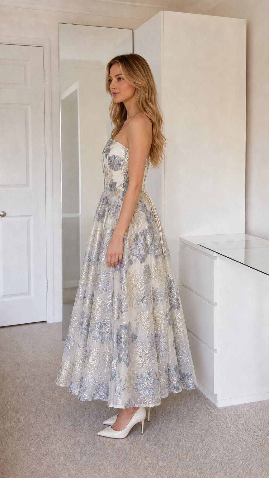 Side profile view of champagne jacquard strapless dress