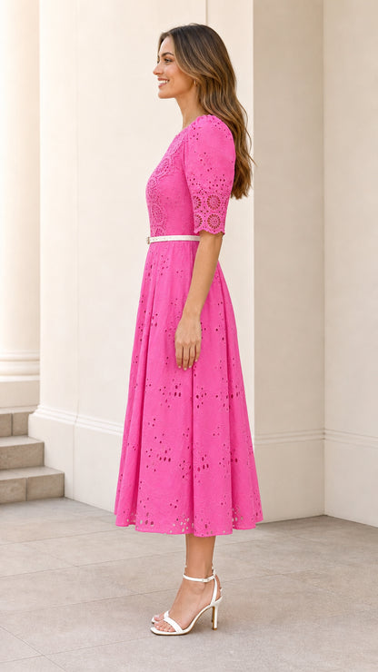 Side profile of hot pink eyelet midi dress