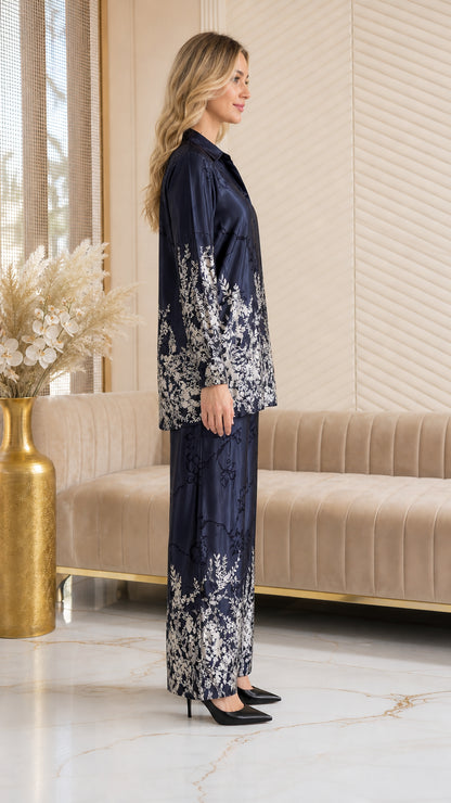Side profile of model in Navy Blue floral satin pajama set