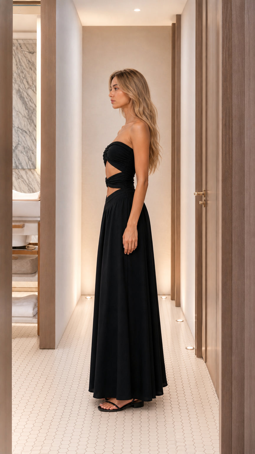 Side profile view of black cutout maxi dress