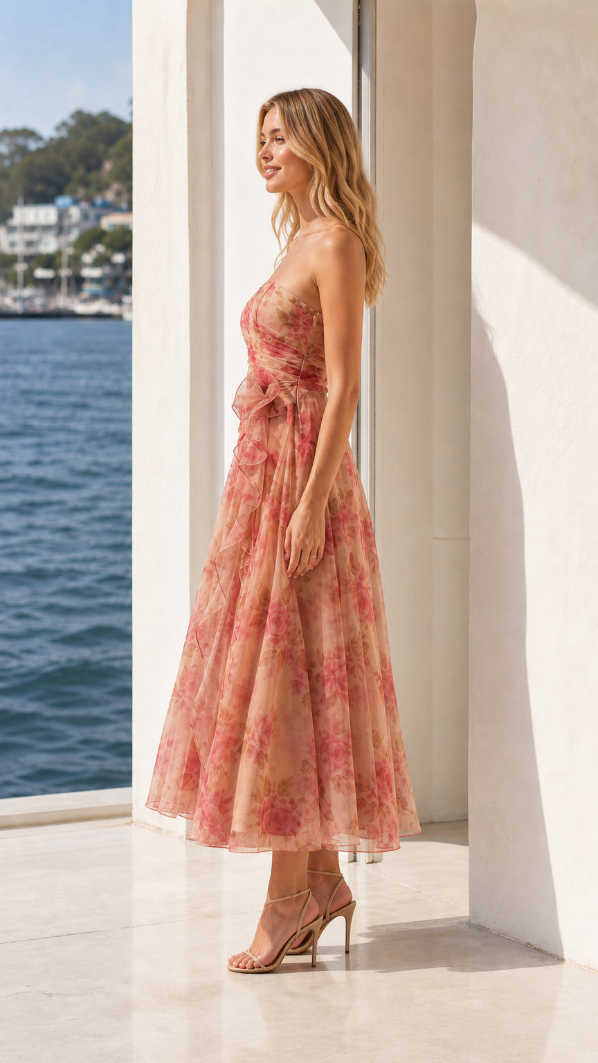 Side profile view of peach floral strapless midi dress