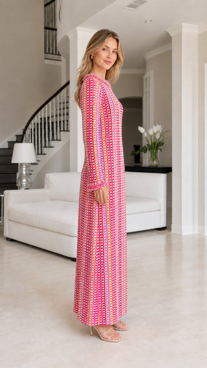 Side profile of model wearing pink striped crochet maxi dress