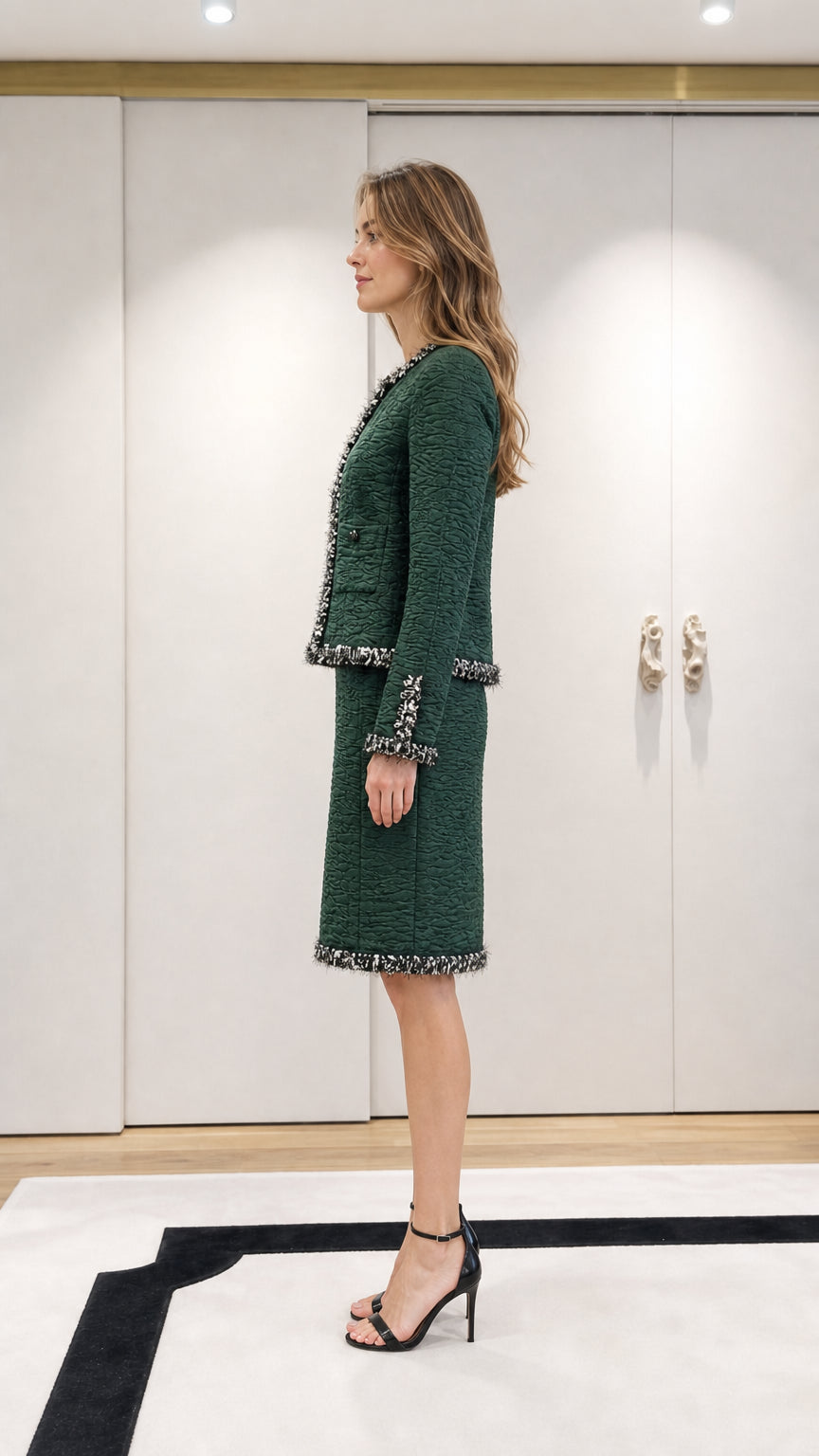 Model wearing green tweed set, side profile