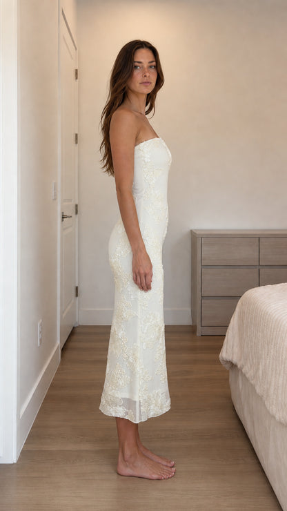 Side profile view of ivory strapless dress