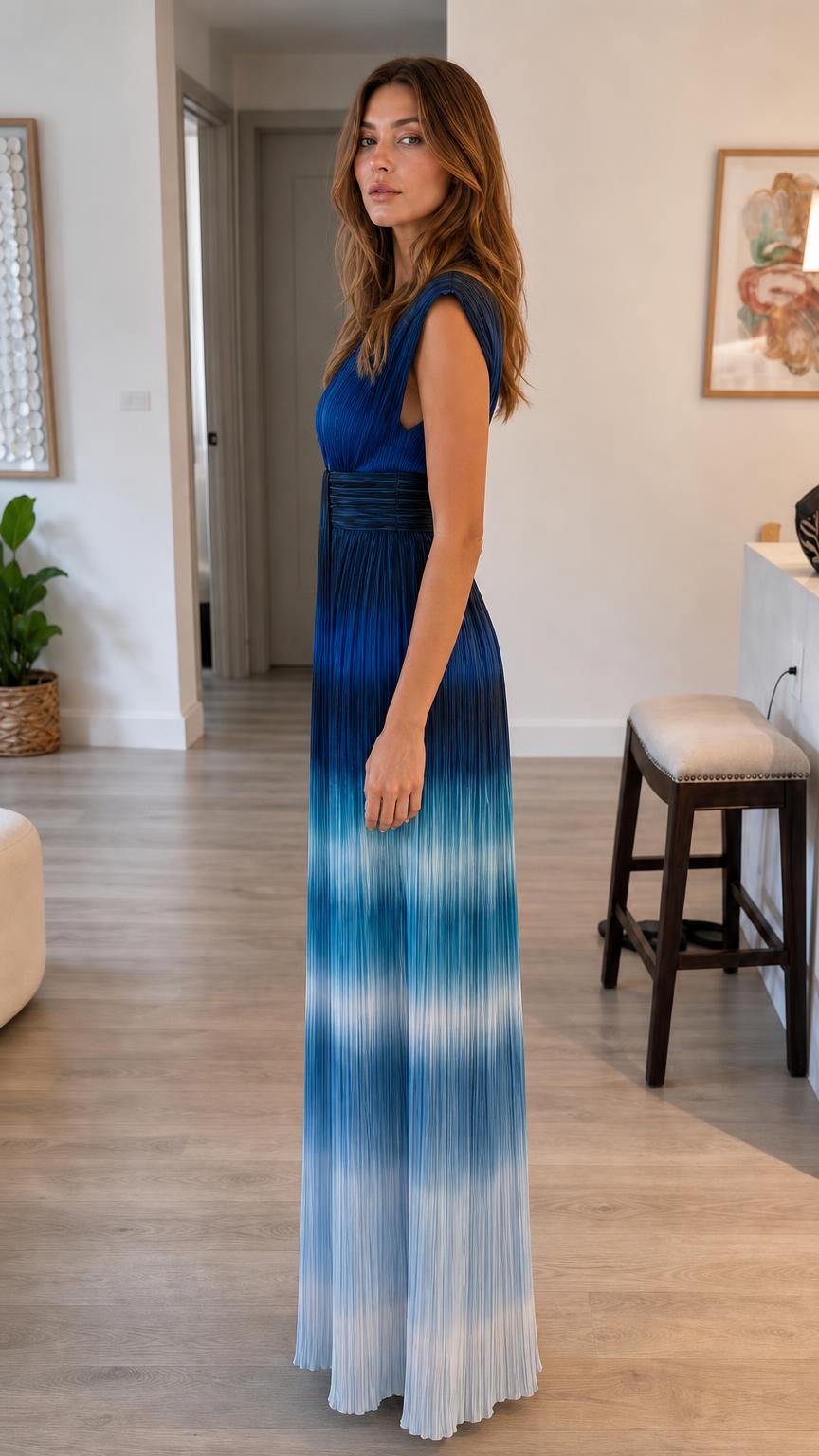 Side profile view of blue ombre pleated maxi dress