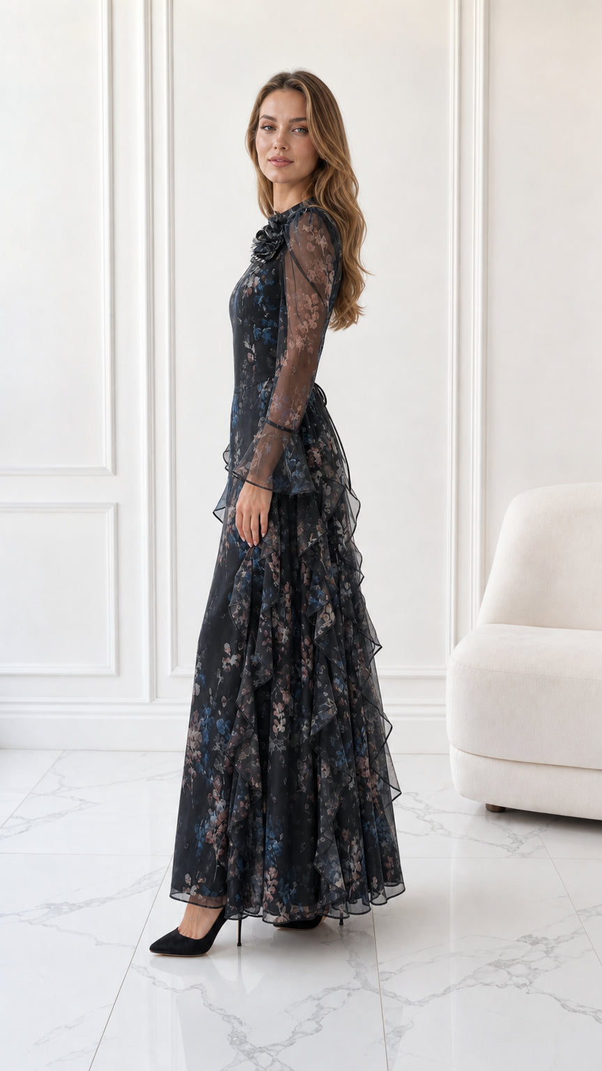 Side full-length view of black floral ruffle maxi dress