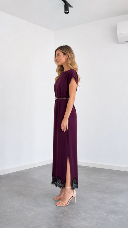 Side angle view of burgundy belted maxi dress with side slit