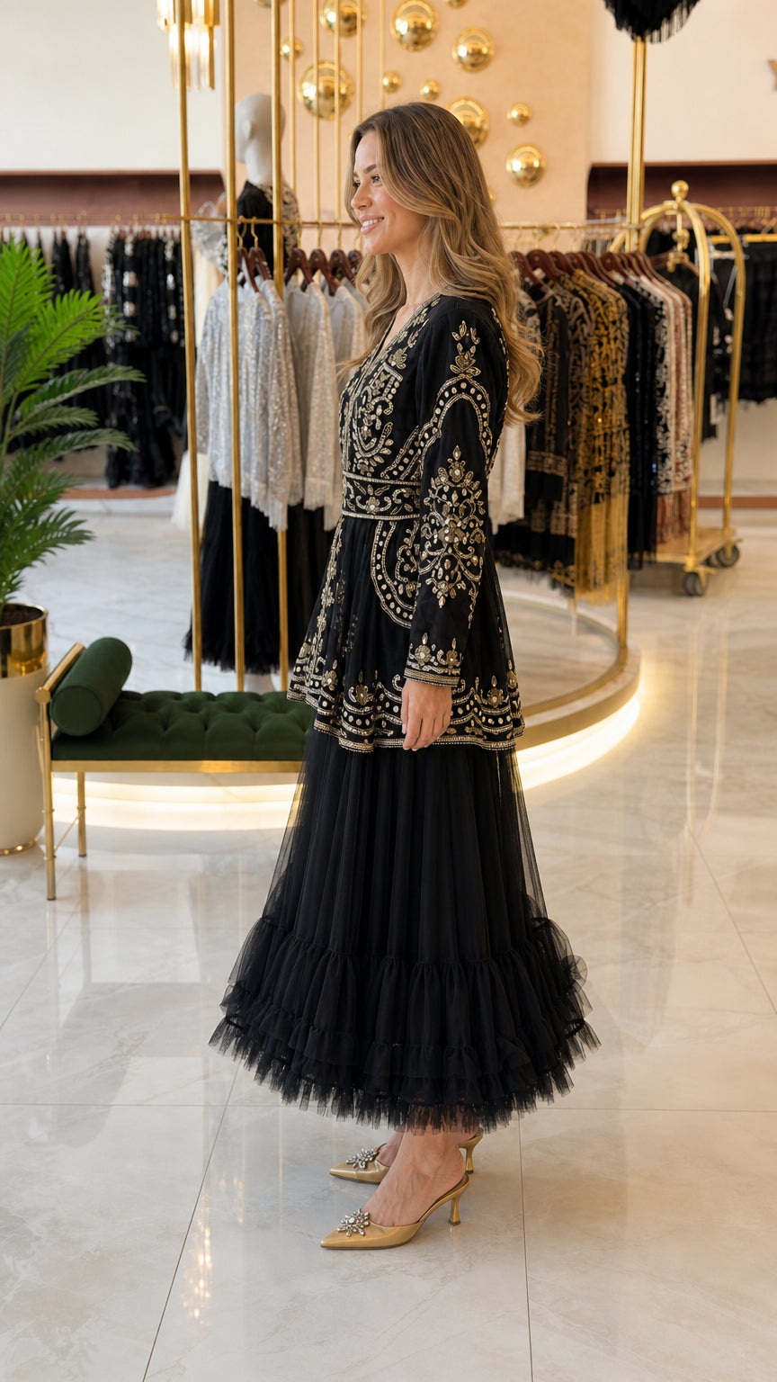 Side angle view of black embellished formal maxi dress