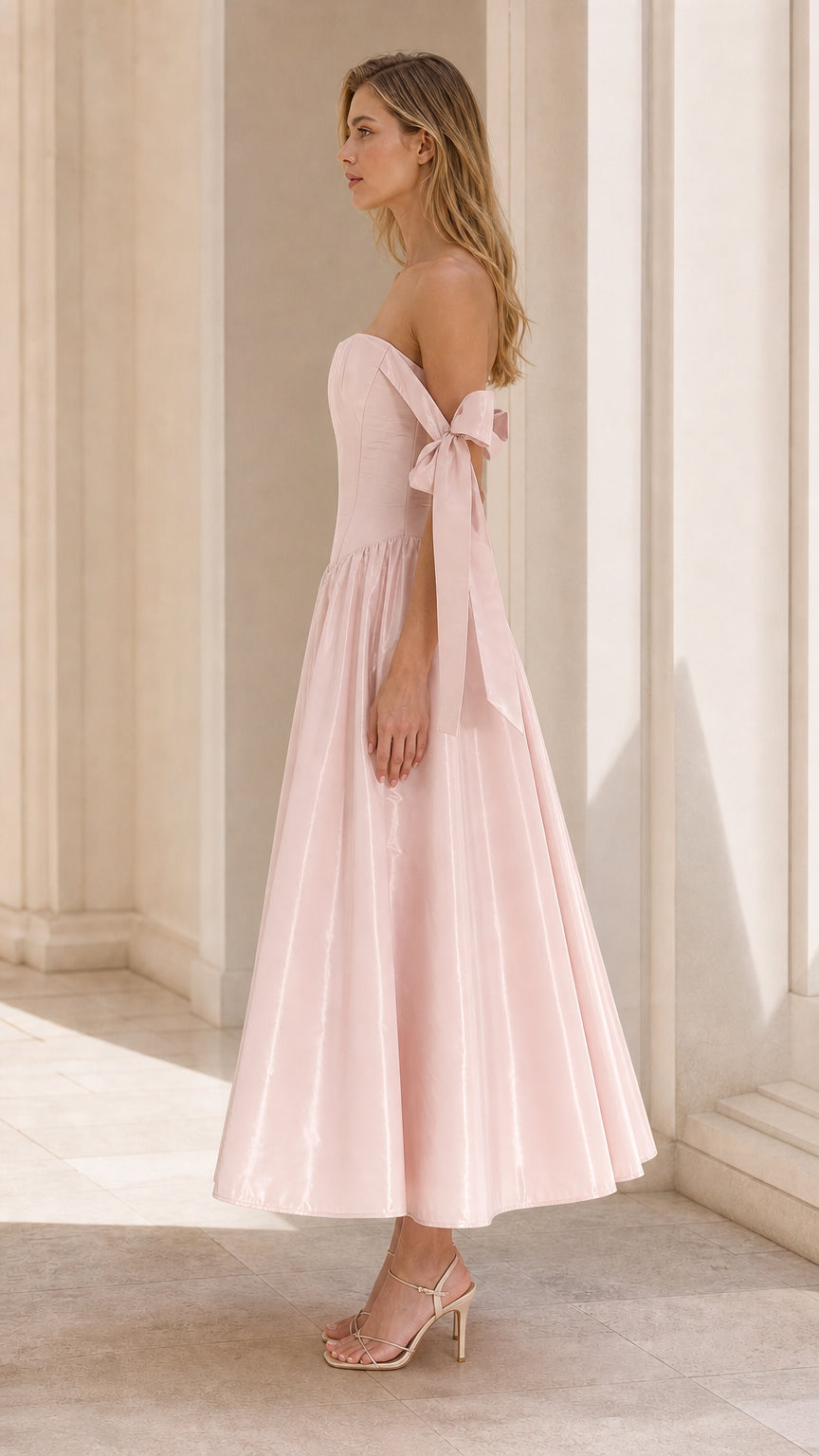 Side profile of Blush Pink corset midi dress showing silhouette and bow arm ties