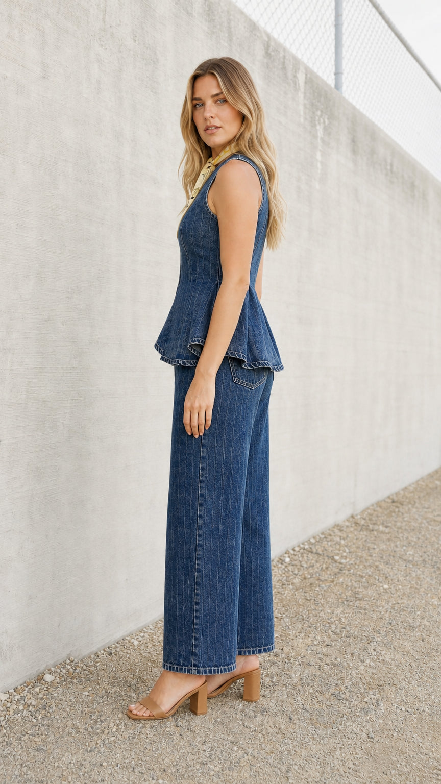 Side profile view of blue denim two-piece set