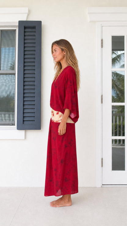 Side profile view of model in Wine Red v-neck draped maxi dress