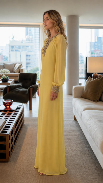 Side profile of woman wearing yellow embroidered maxi dress