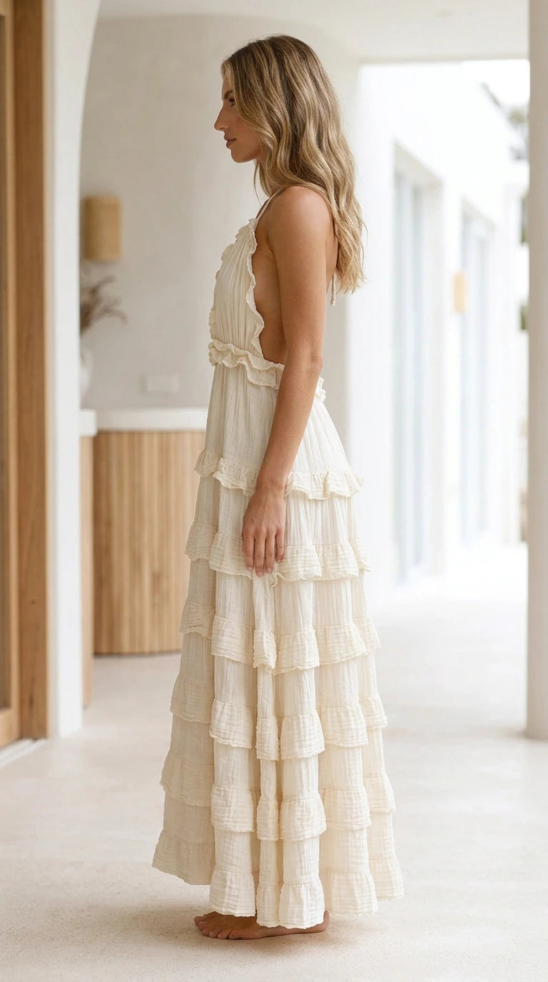 Model wearing White Boho Ruffle Halter Backless Tiered Maxi Dress side view