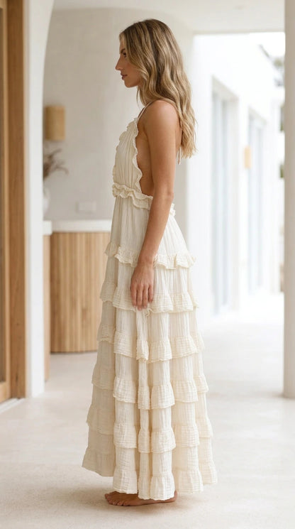 Model wearing White Boho Ruffle Halter Backless Tiered Maxi Dress side view