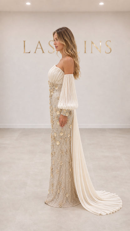 Side profile of champagne floral beaded formal maxi gown with sweeping drape