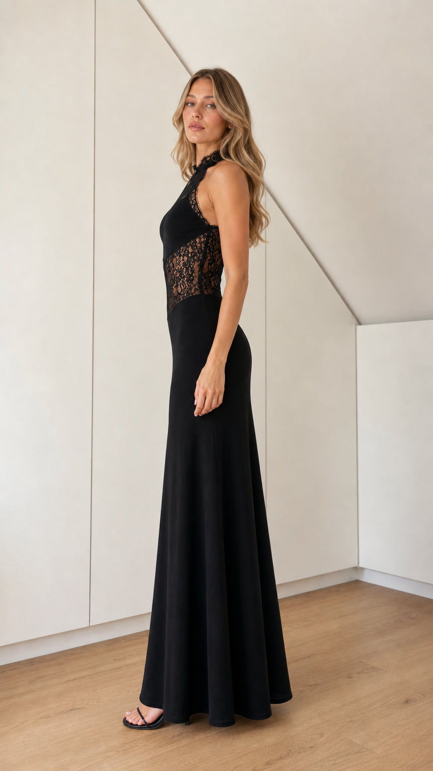 Side profile of black sleeveless lace corset evening gown