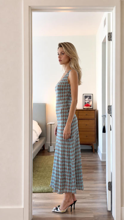 Side profile of model wearing blue argyle dress