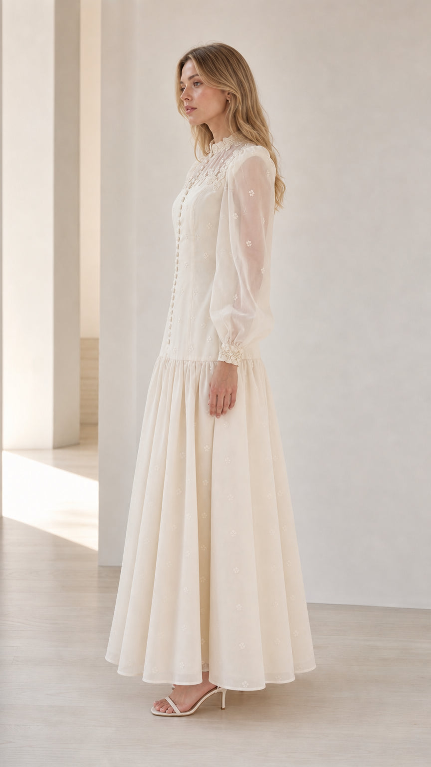Side angle of woman in Ivory sheer sleeve modest maxi dress