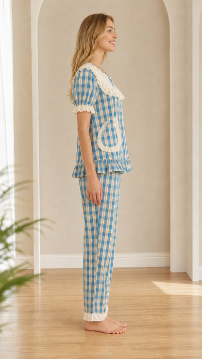 Side profile view of model in light blue plaid two-piece loungewear set