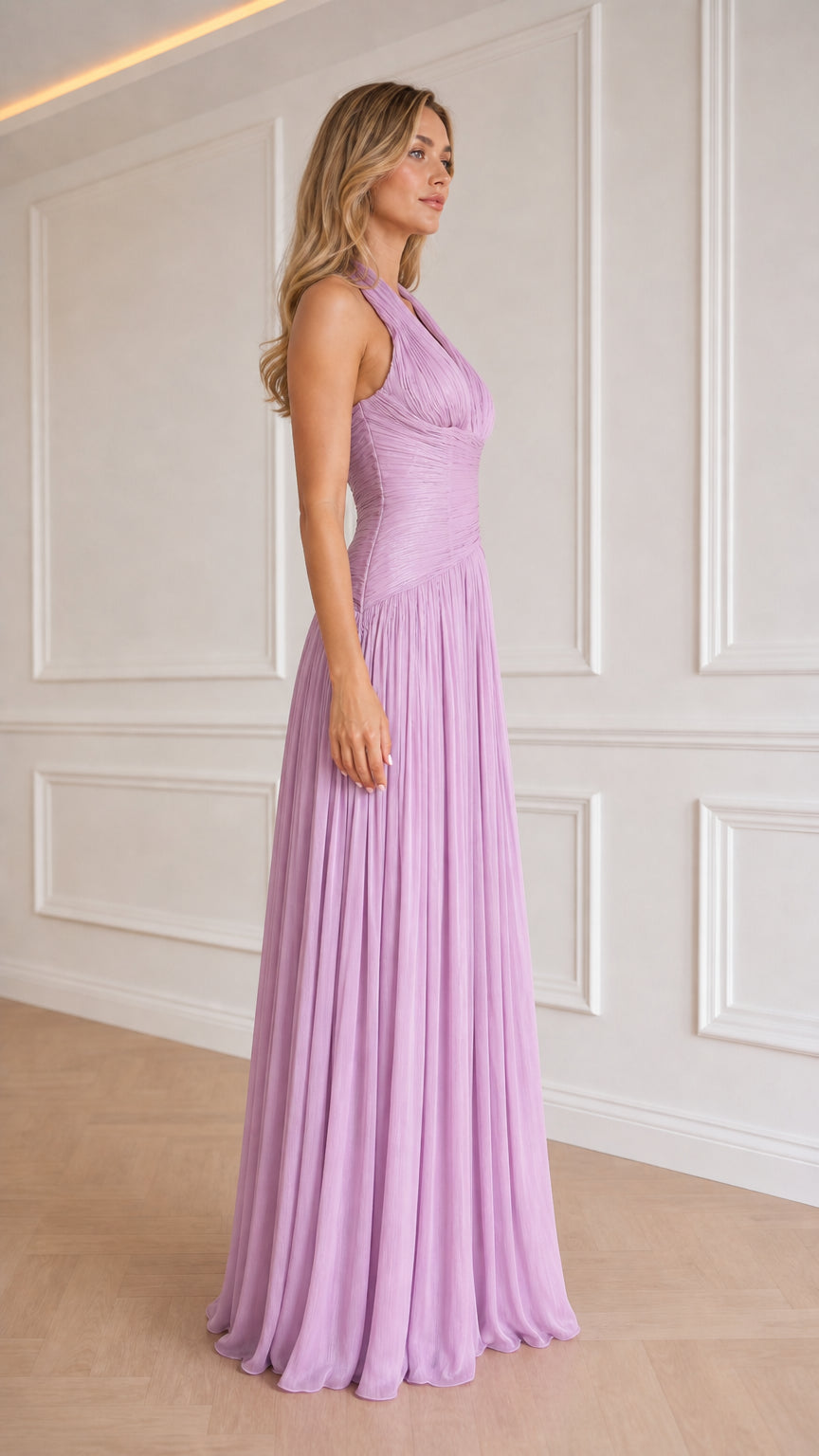 Side profile view of model in lavender evening gown