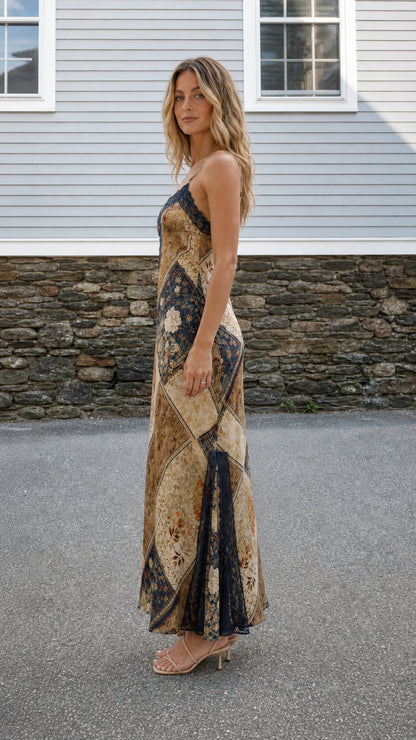 Side profile of model wearing Brown Multi maxi dress