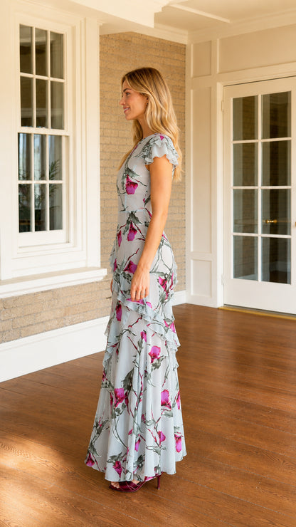 Side profile view of model in light blue floral maxi dress