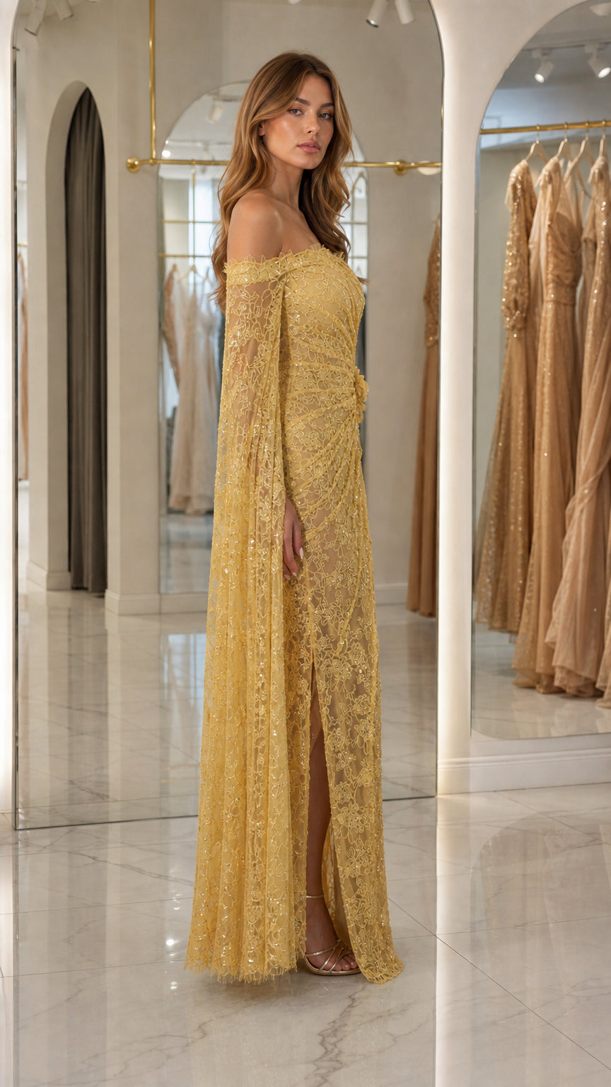 Side profile view of woman in gold evening gown showing high slit