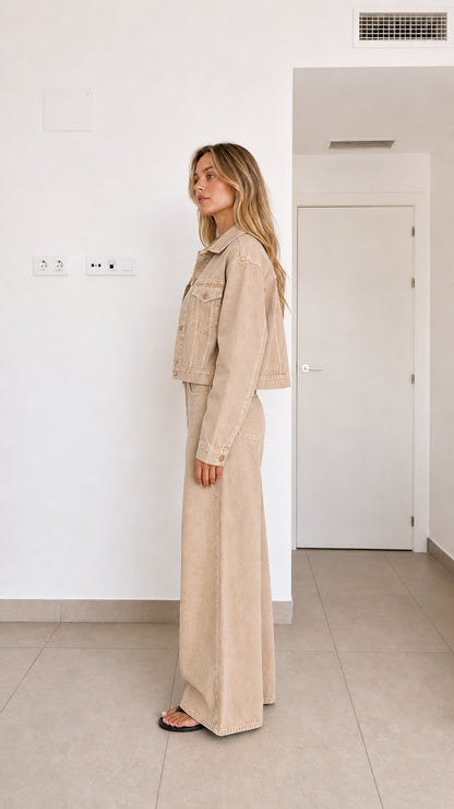 Side view of woman in beige two-piece wide-leg denim coordinate set