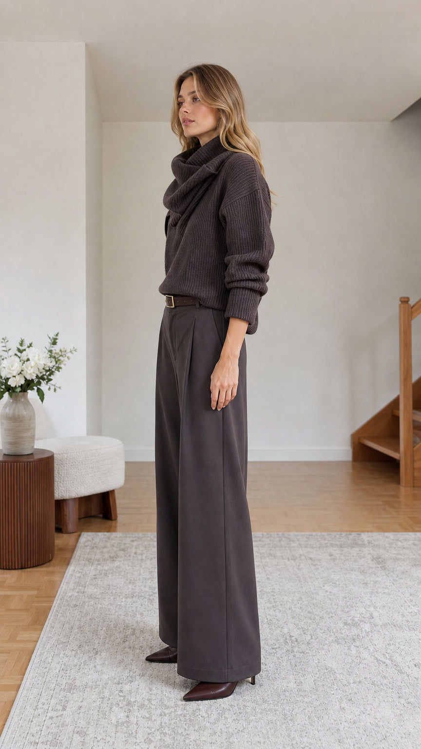 Side profile view of dark brown draped cowl neck ribbed knit sweater