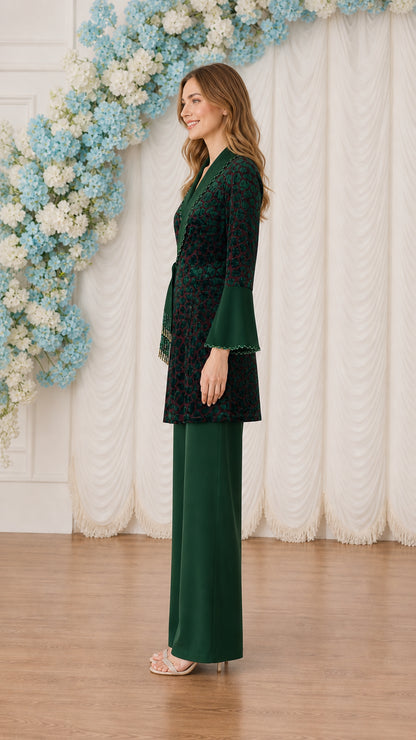 Side profile view of model in Dark Green long sleeve wrap tunic pant set