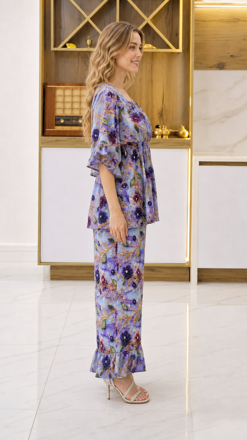 Side profile view of woman wearing Periwinkle Blue floral matching top and pant set