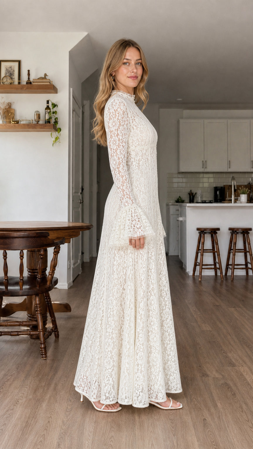 Side profile of model in white lace maxi dress showing floor-length fit