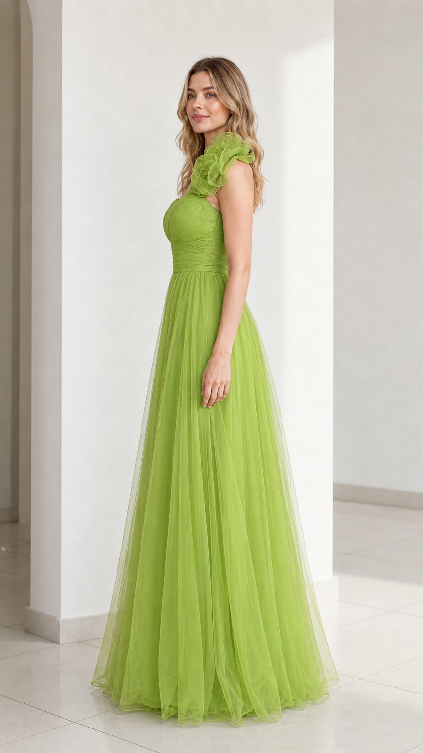 Side profile view of green one-shoulder evening gown