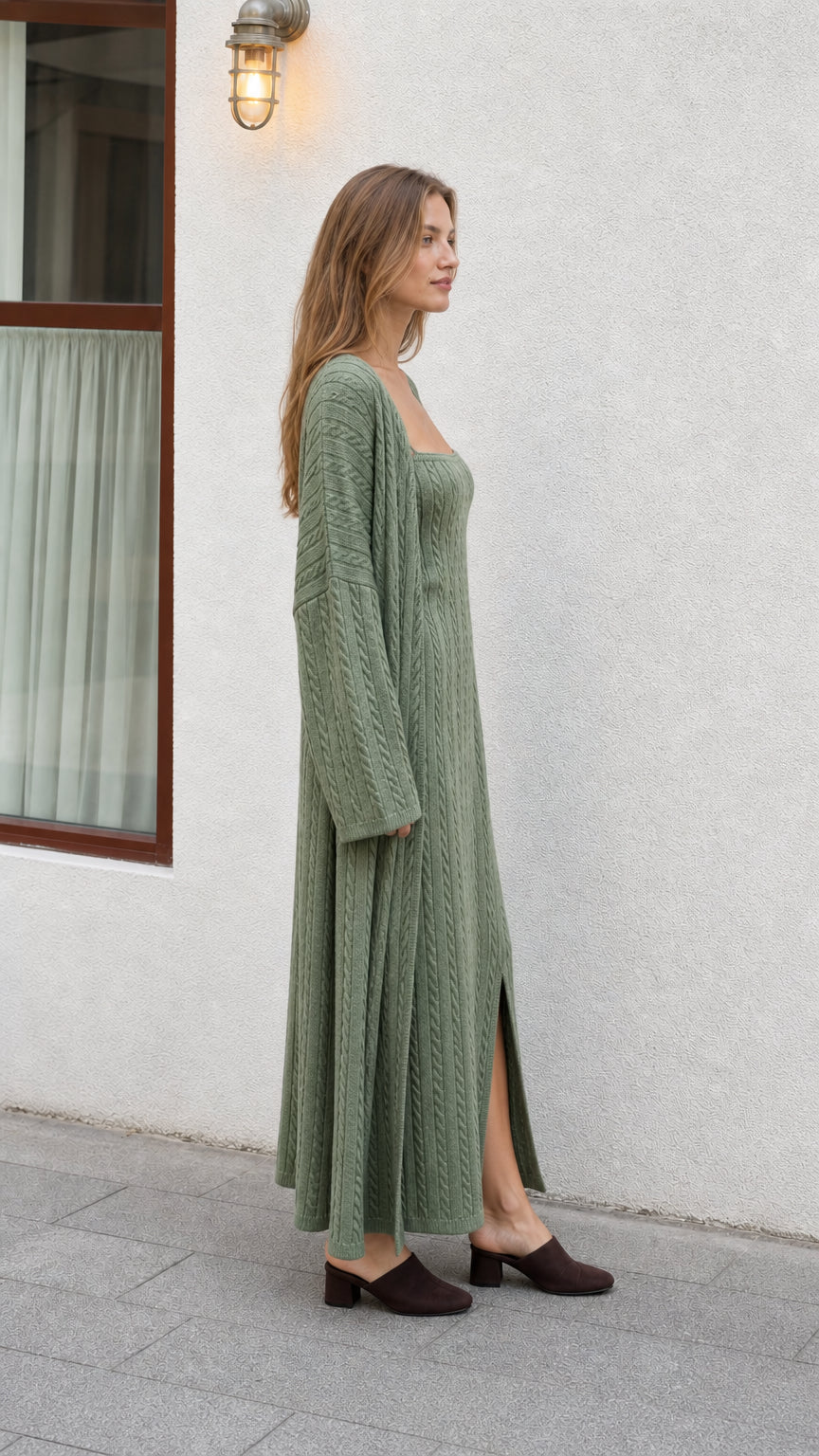 Side angle view of model in Sage Green knit maxi dress and matching open cardigan