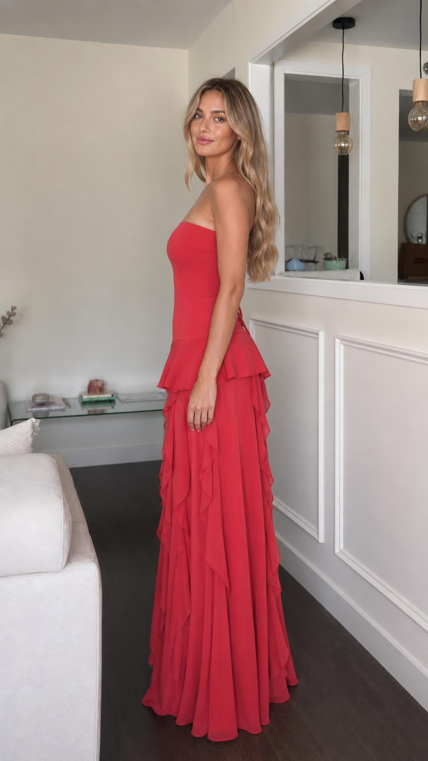 Side profile view of red strapless ruffle maxi dress