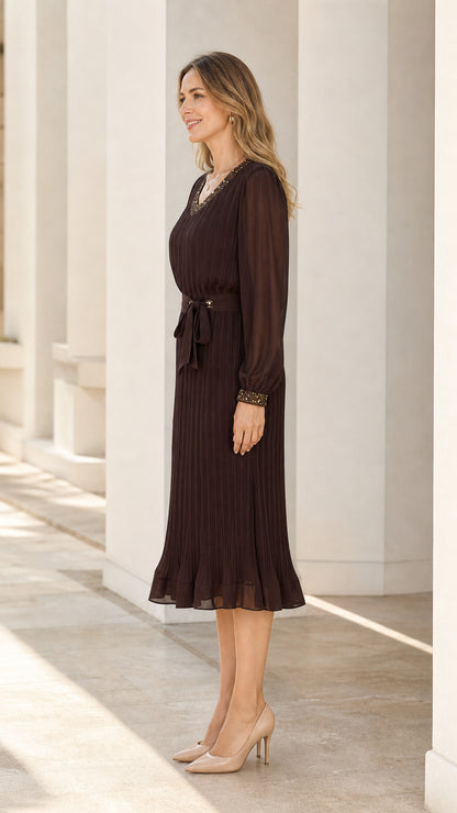 Side profile of dark brown pleated midi dress