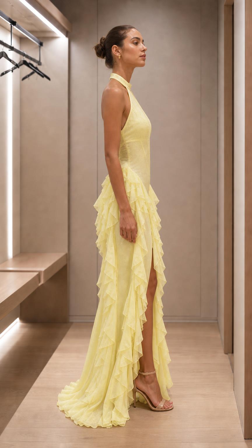 Side profile view of yellow evening dress with high slit
