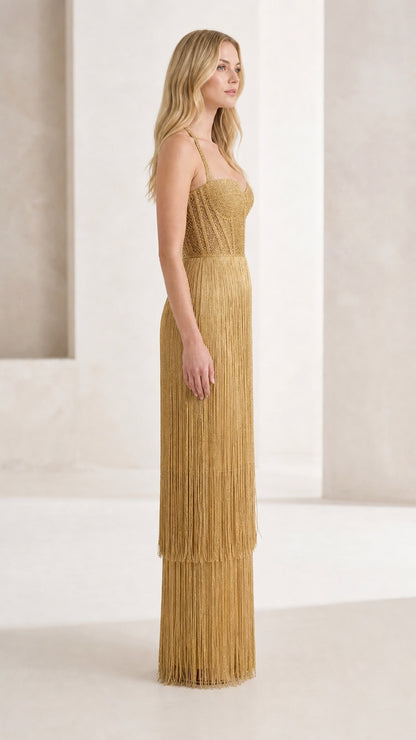 Side profile view of gold fringe maxi dress