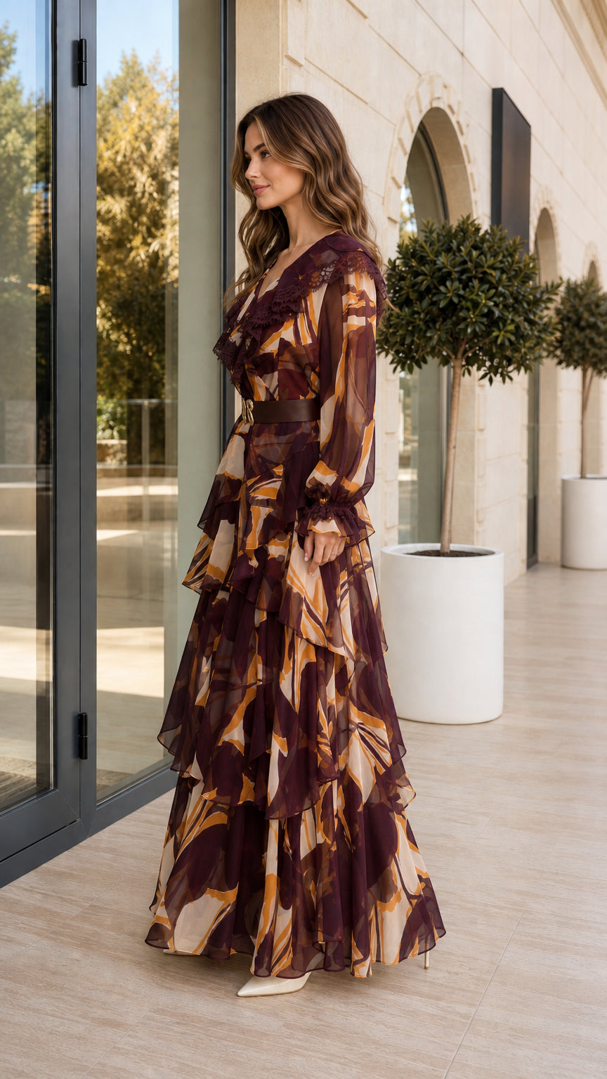 Side angle view of burgundy tiered ruffle maxi dress showing flowy silhouette