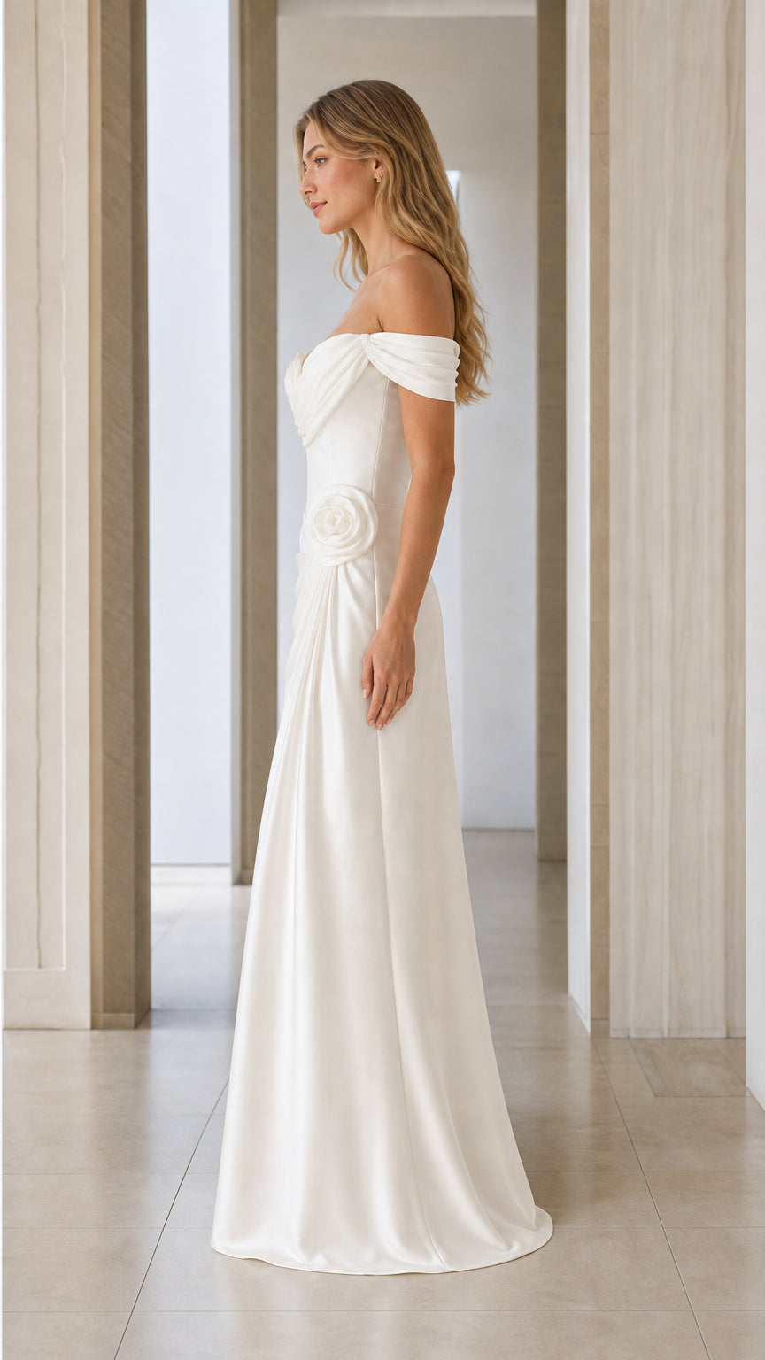 Side profile of white off-shoulder satin evening gown