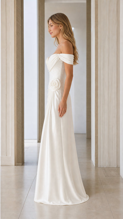 Side profile of white off-shoulder satin evening gown