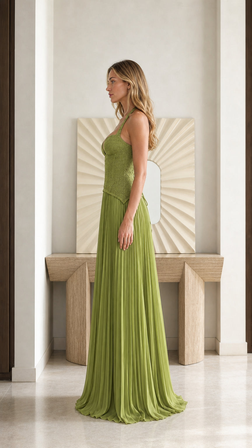 Side profile view of olive green halter corset pleated evening dress