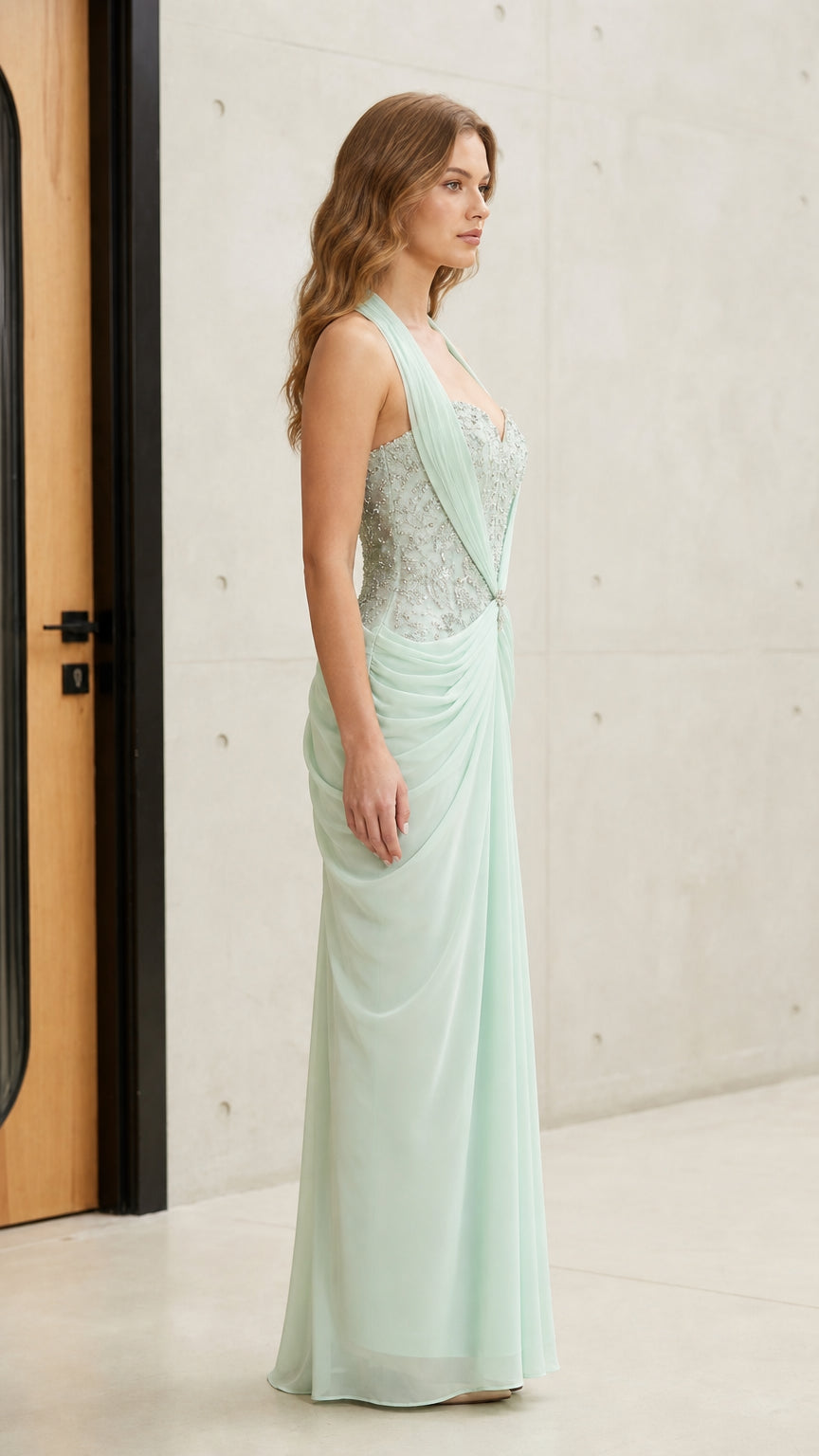 Mint green formal maxi gown with beaded bodice - side profile view