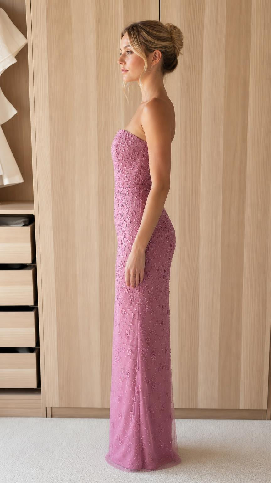 Side profile view of model in mauve evening gown